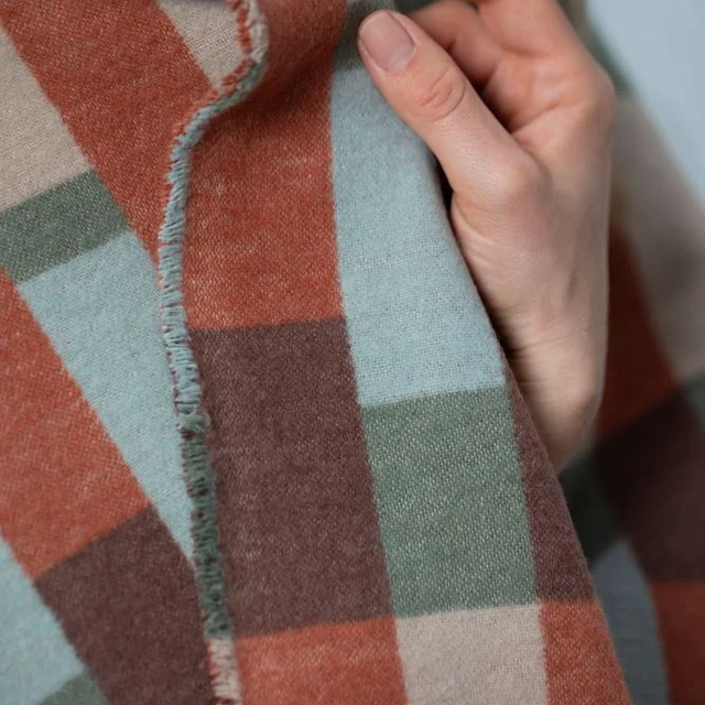 LUCA Throw "Patchwork" green — close-up of the woven finish